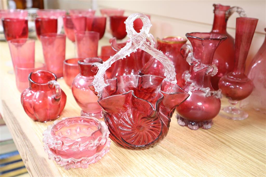 A collection of Victorian and later cranberry and ruby coloured glassware, ewer 18cm